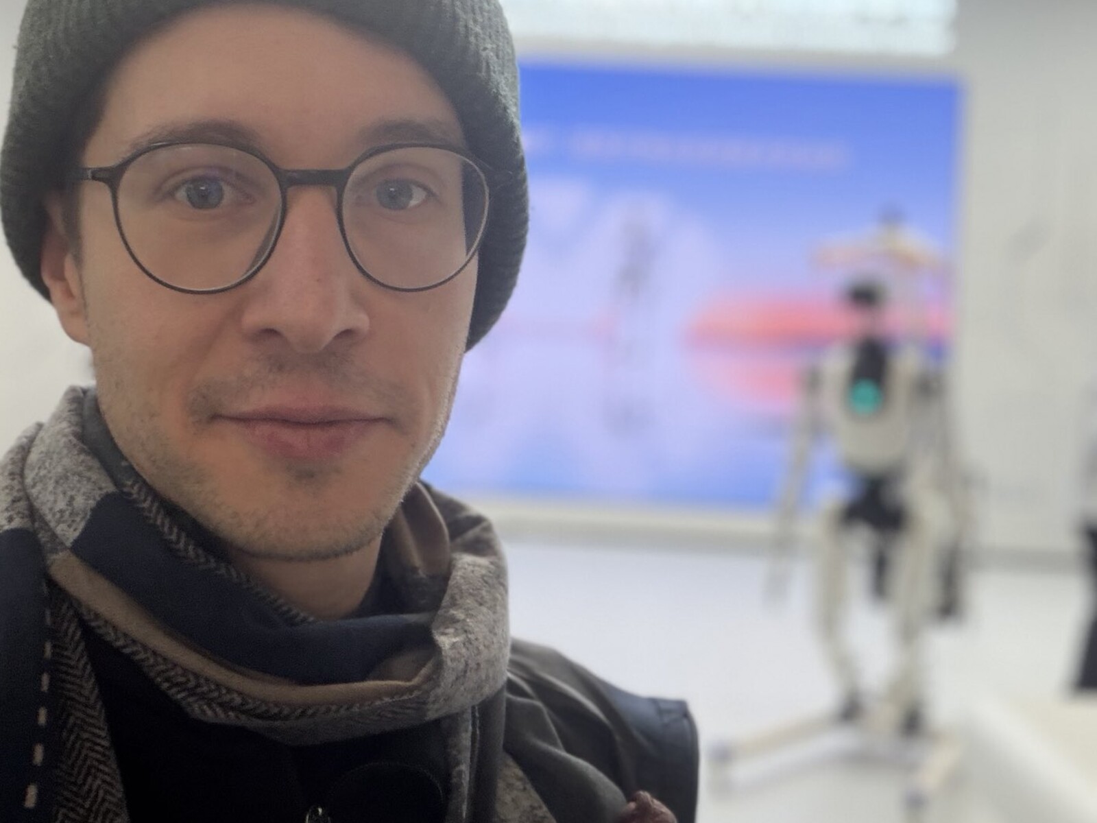 Dr. Dom at the X-Humanoid robot center in Beijing, a Tiangong humanoid robot behind him